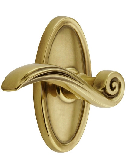 Oval Rosette Set With Elan Levers Left Hand in Antique Brass.